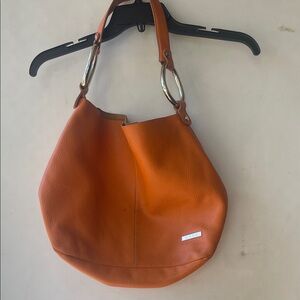 Chic Orange Hobo Bag with Silver Accents